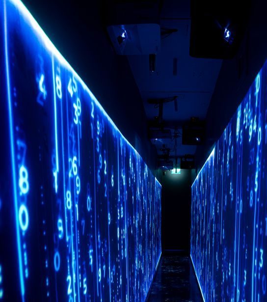 A luminous blue tunnel with digital numbers creating a futuristic, sci-fi ambiance.